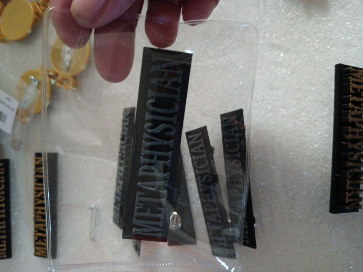 Metaphysician black and gray 3D-printed lapel pins