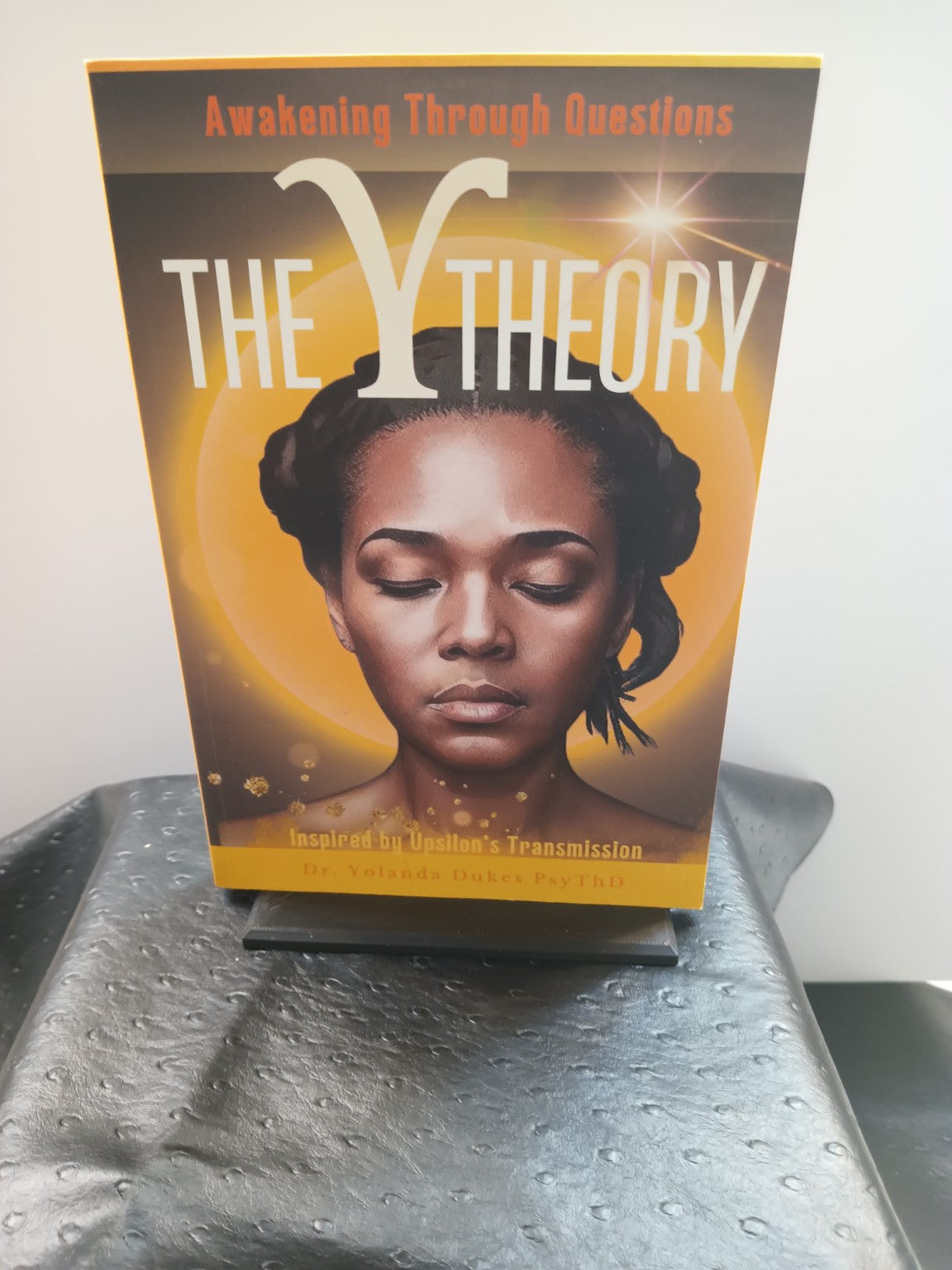 Physical copy of The Y Theory: Awakening Through Questions by Dr. Yolanda Dukes