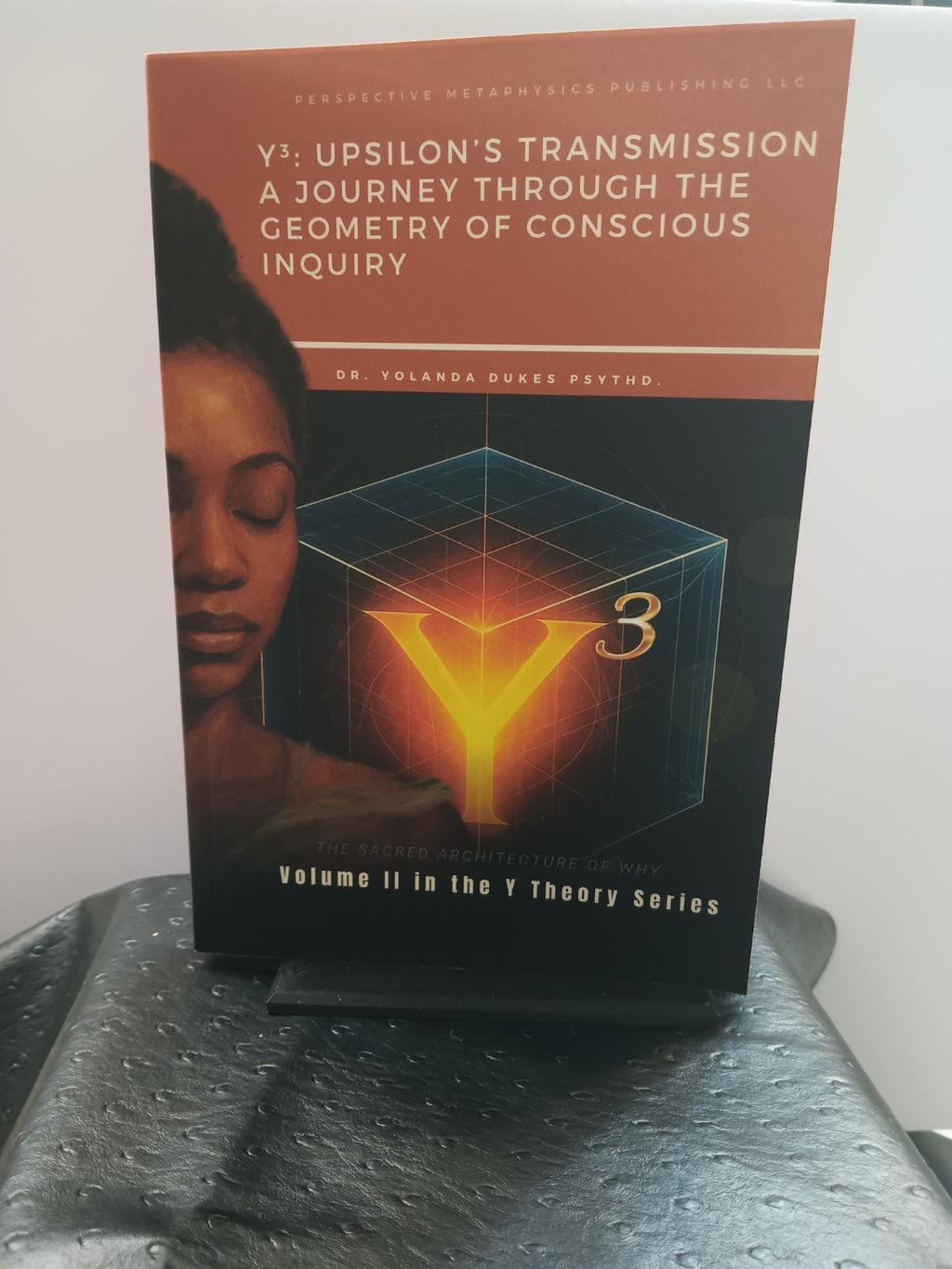 Physical copy of Y cubed: Upsilon's Transmission by Dr. Yolanda Dukes